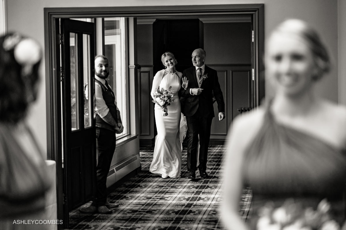 bride waves as arrives