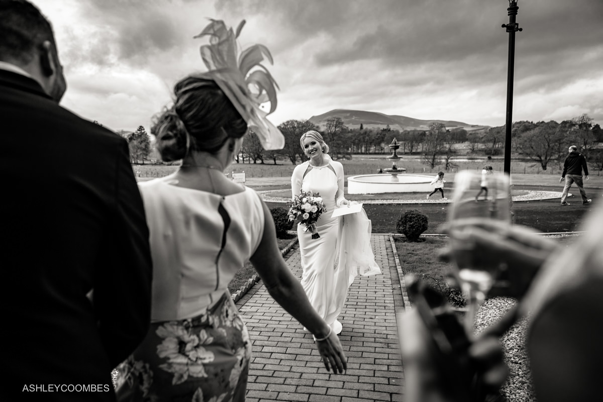 wide angle layered black and white photo of bride