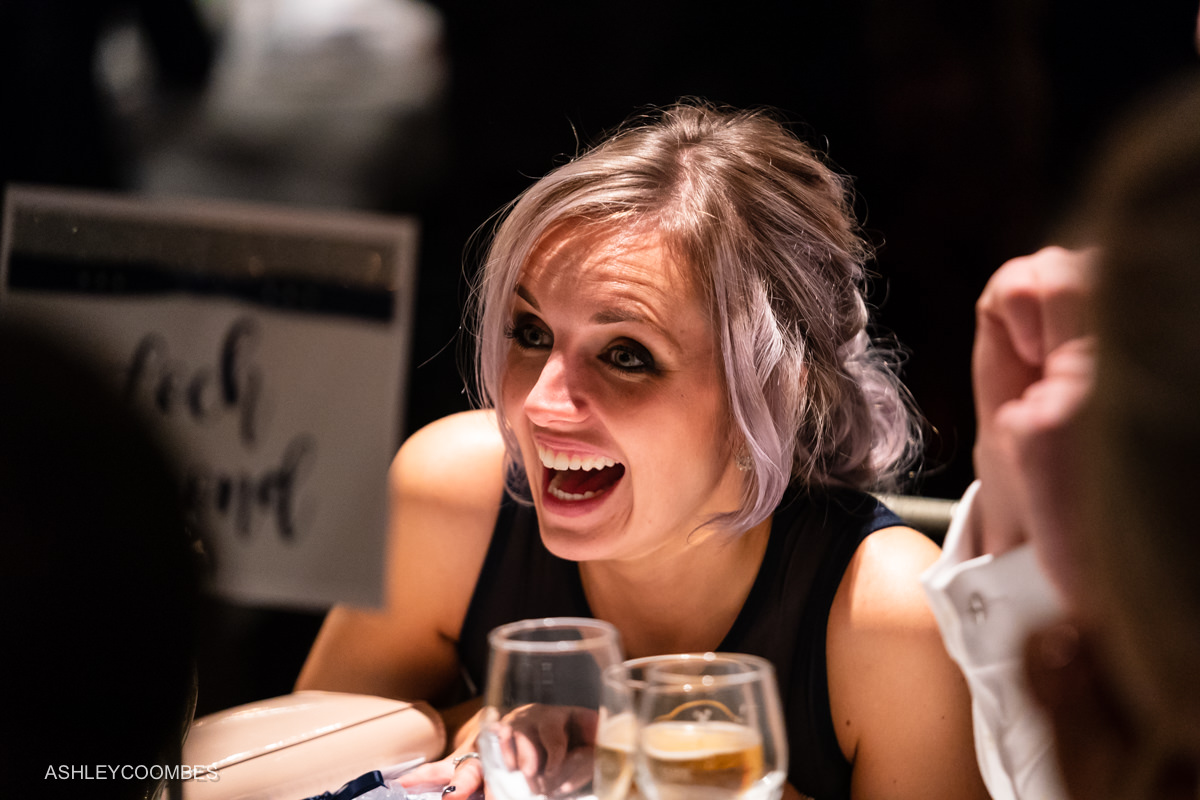 wedding guest laughing
