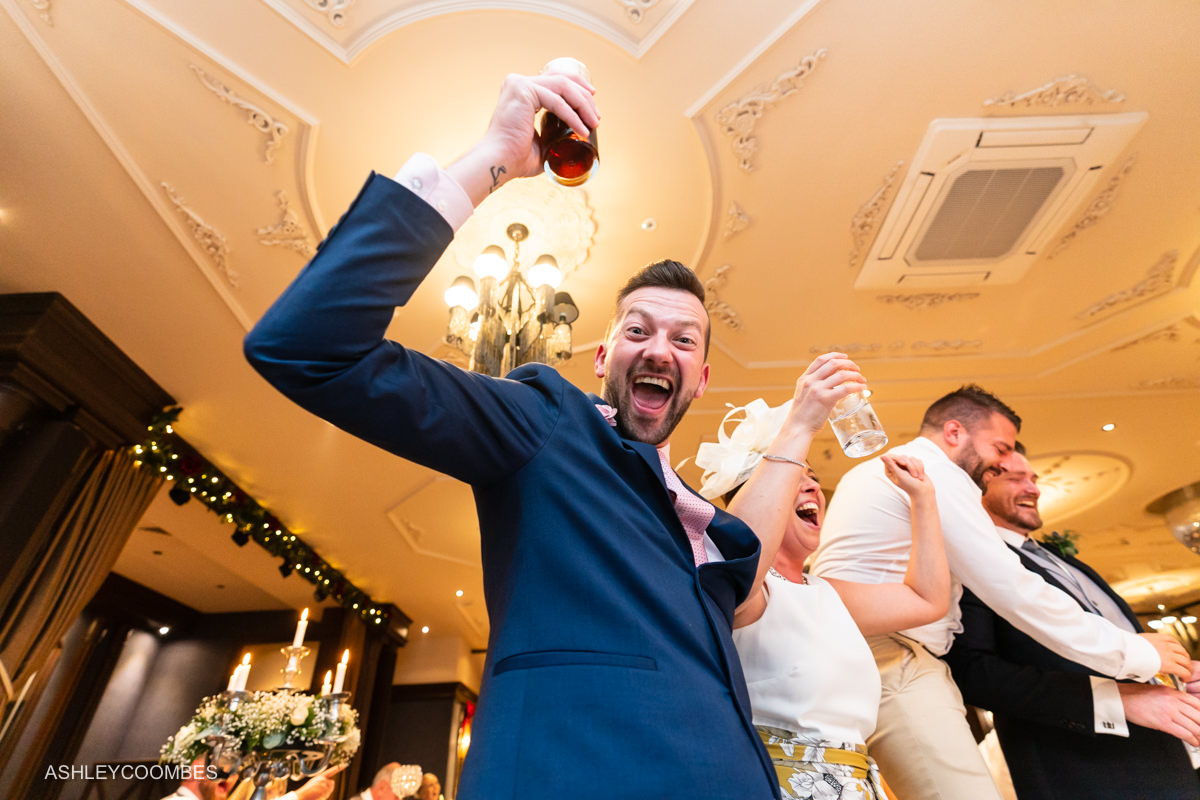 guests on chairs cheering