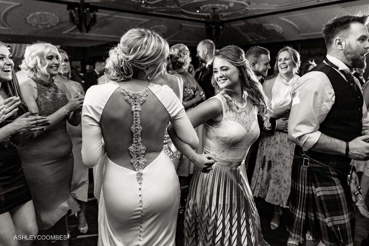 bride dancing with friends