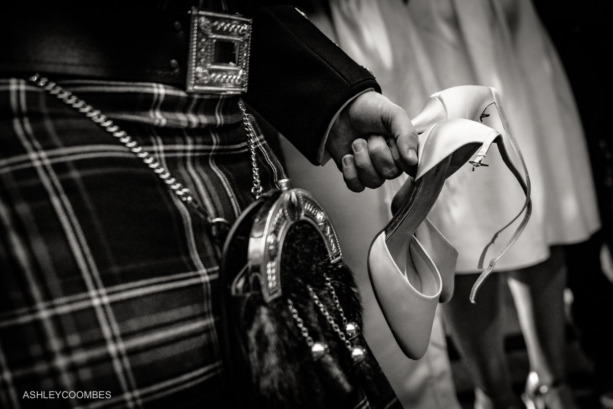 holding brides shoes